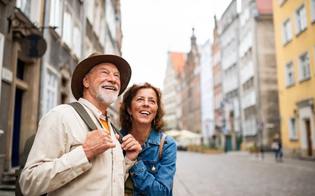 Happy tourists admiring historic architecture
