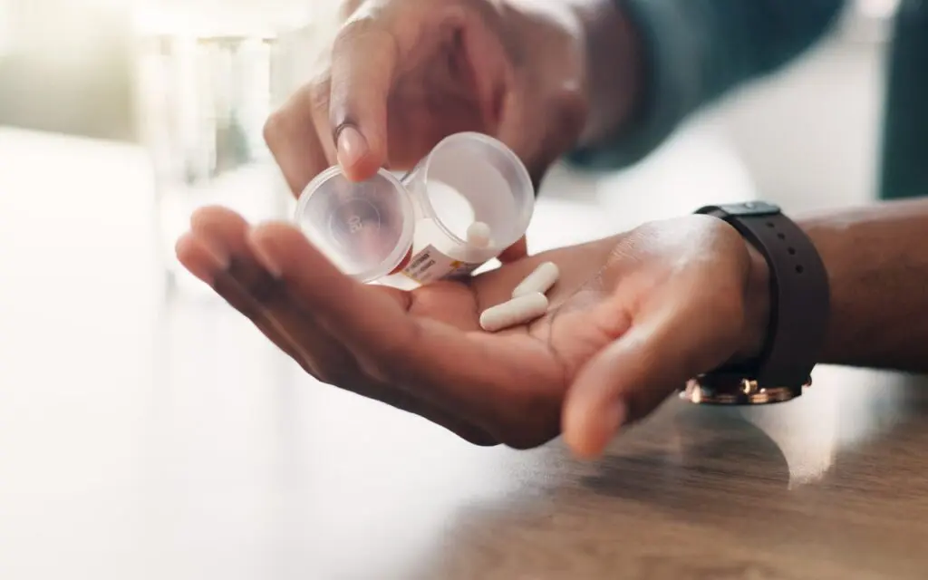 Medication being dispensed from bottle