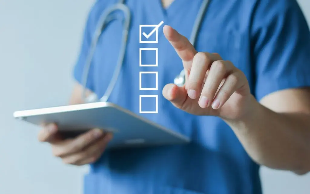 Doctor using digital checklist