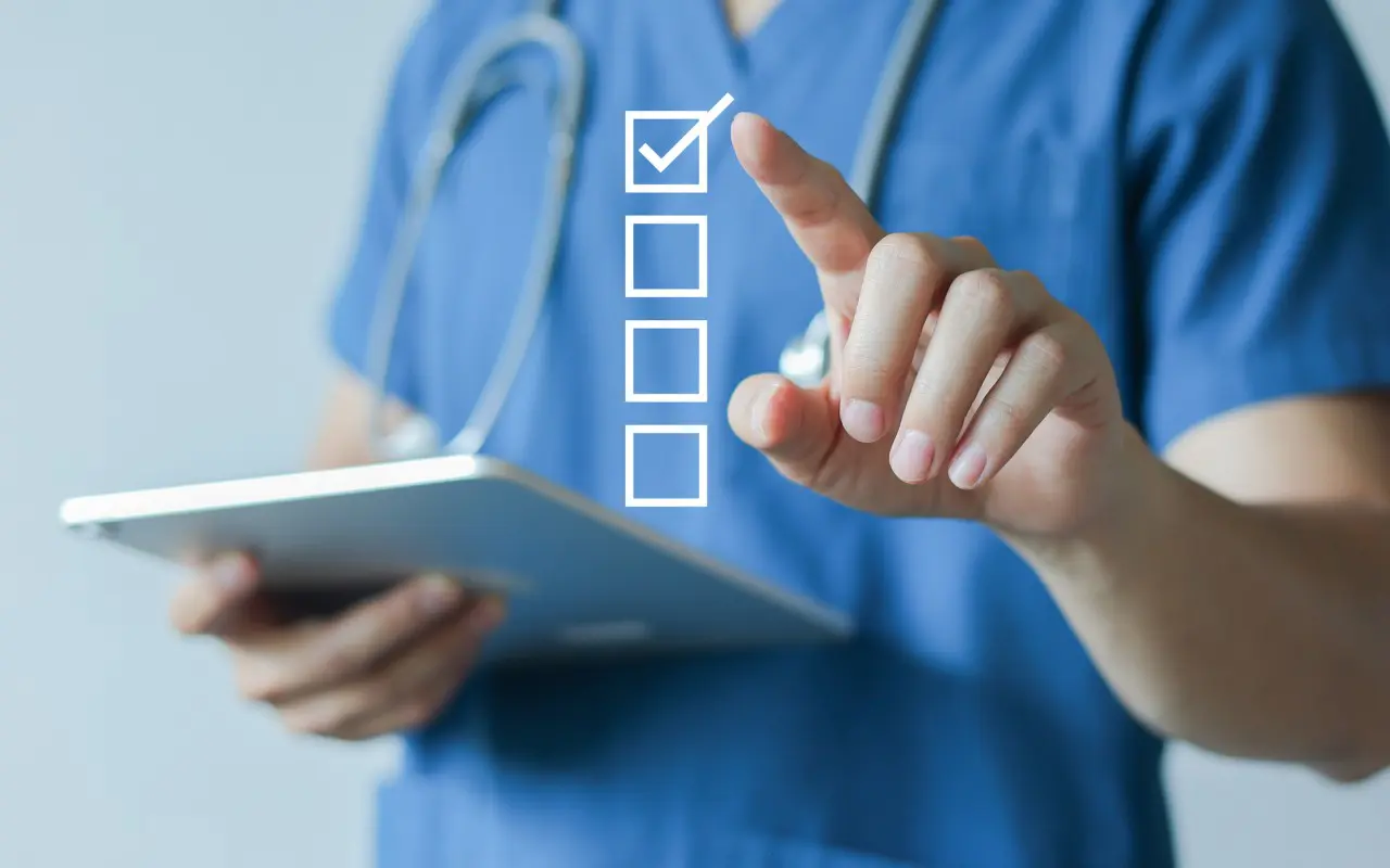 Doctor using digital checklist