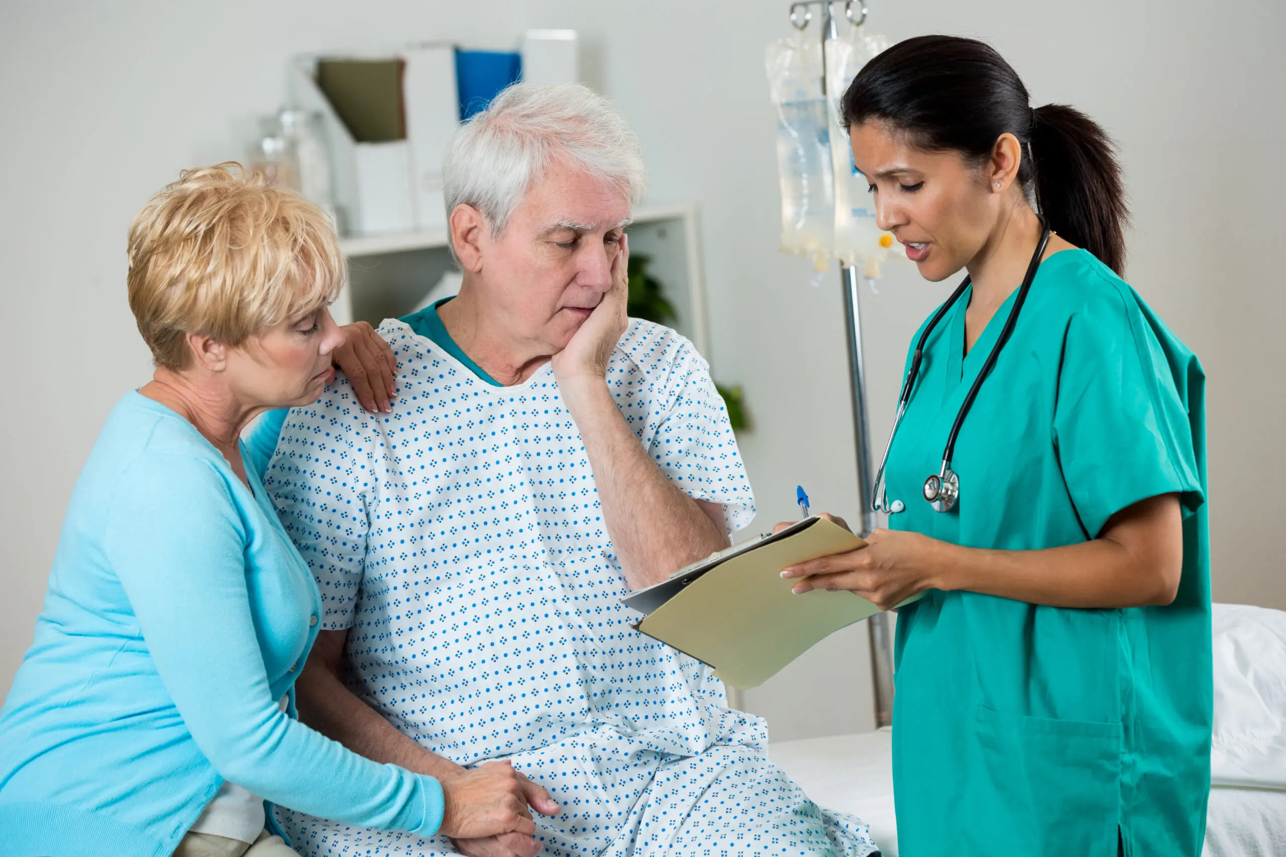 Doctor discussing with patient and caregiver