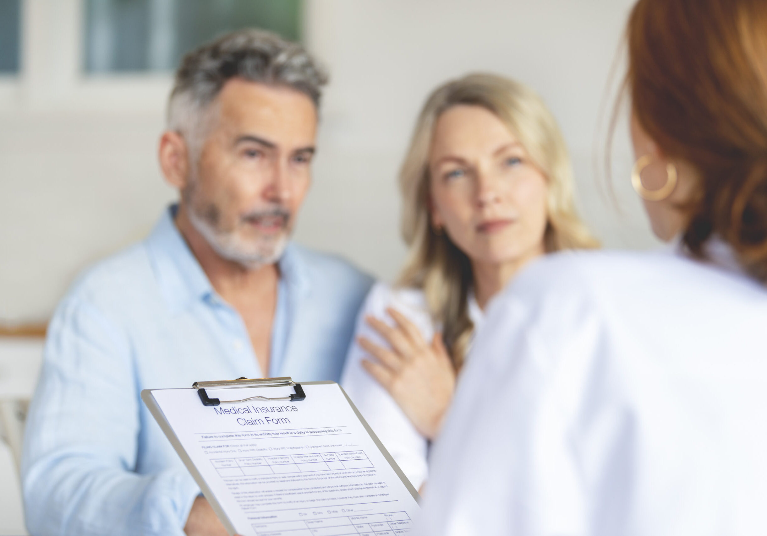 Couple discussing with doctor