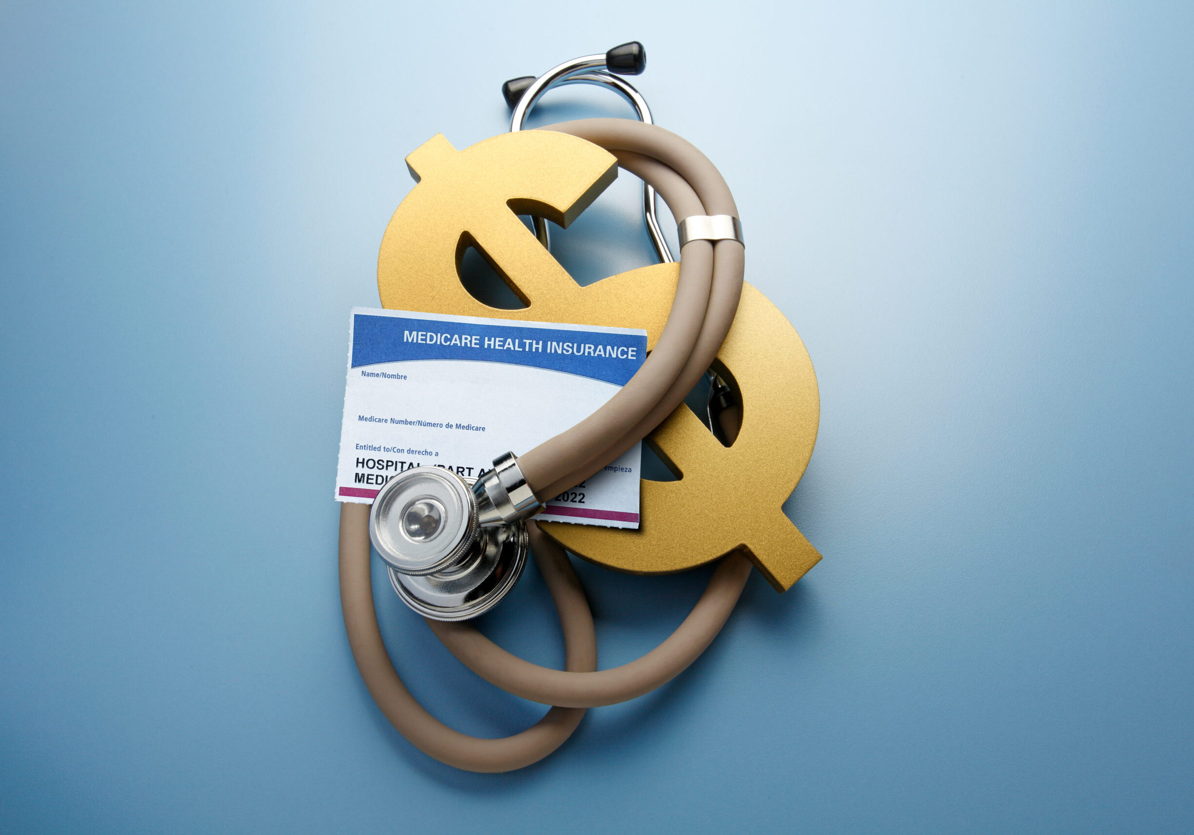 Medicare insurance with stethoscope and dollar sign