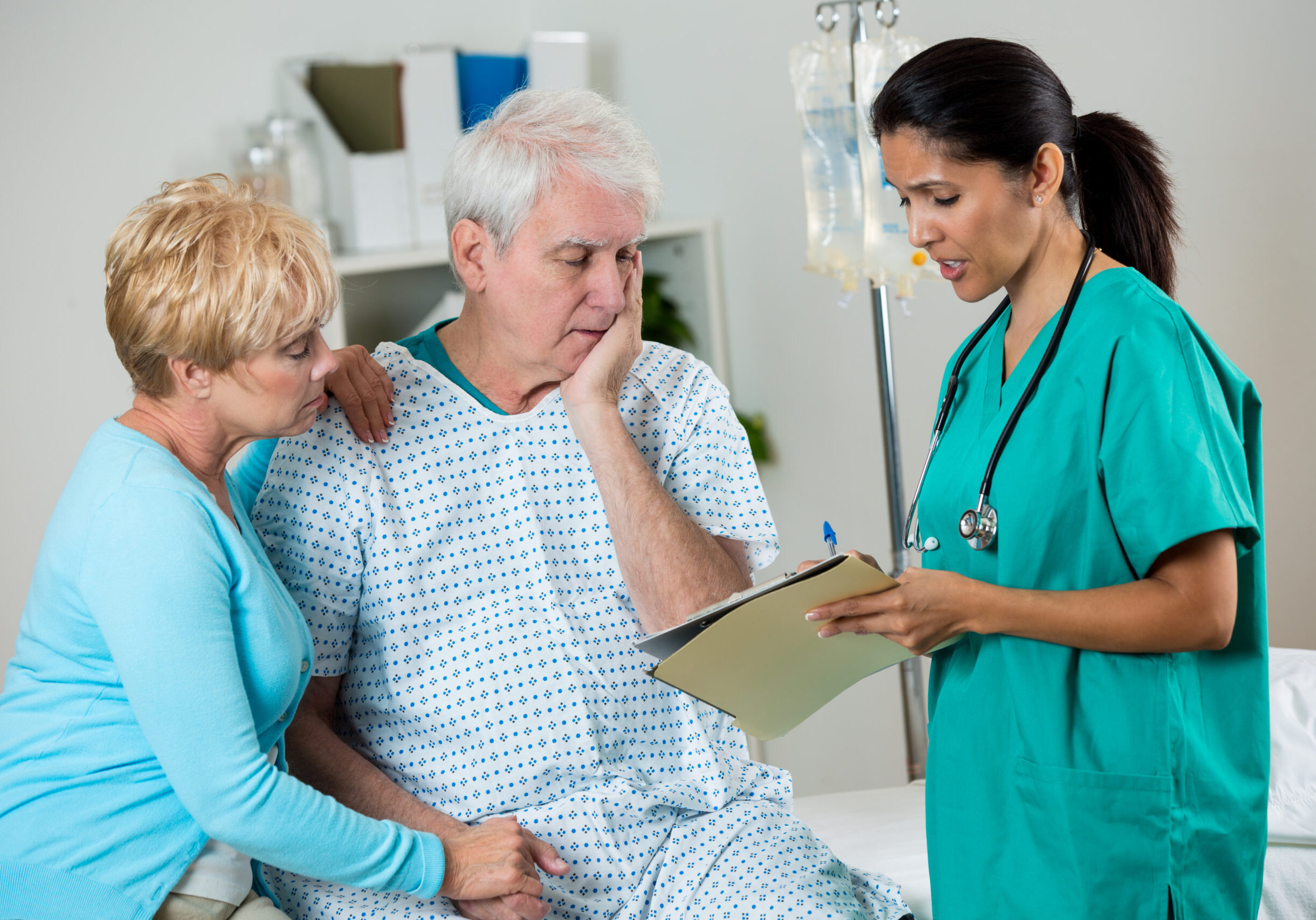 Doctor discussing with patient and caregiver